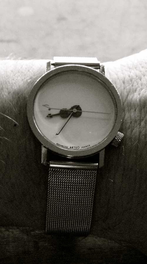 Photo of a violin watch on a wrist